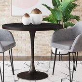 black tulip table and gray arm chairs